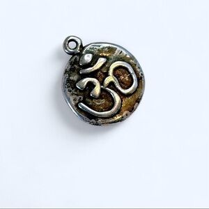 Silver tone Om Pendant plain back with a grunge vibe perfect for necklace